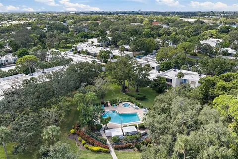 an aerial view of house with yard swimming pool and outdoor seating