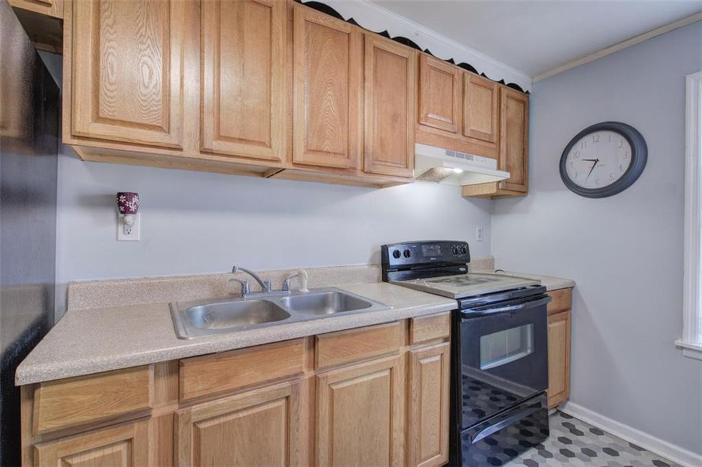 92 South Avery Road Southwest Rome, GA 30165 - Photo 17 of 39 a kitchen with stainless steel appliances granite countertop a sink a stove and cabinets