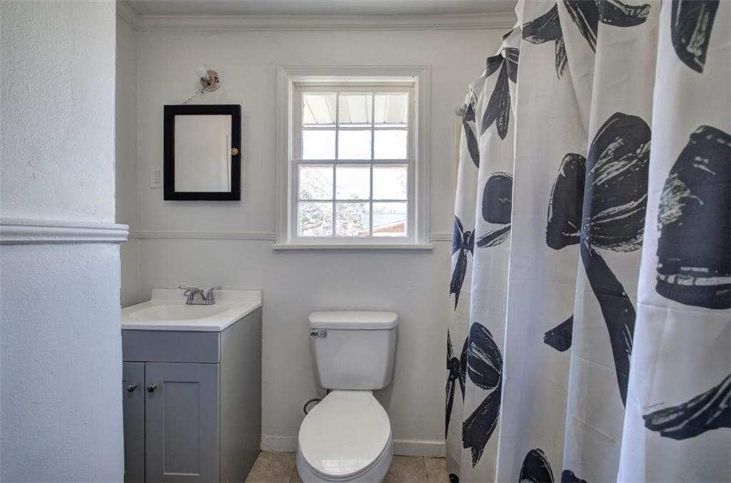 92 South Avery Road Southwest Rome, GA 30165 - Photo 26 of 39 a bathroom with a toilet sink and mirror