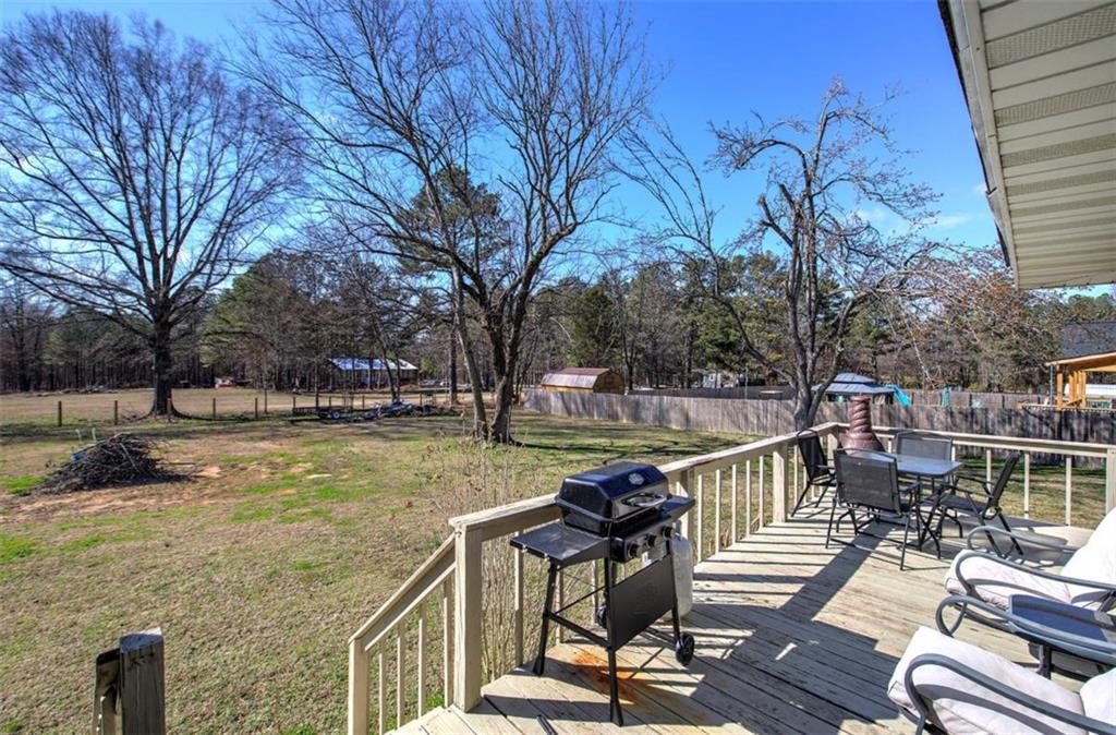 92 South Avery Road Southwest Rome, GA 30165 - Photo 34 of 39 a view of a lake with chairs and table on the patio