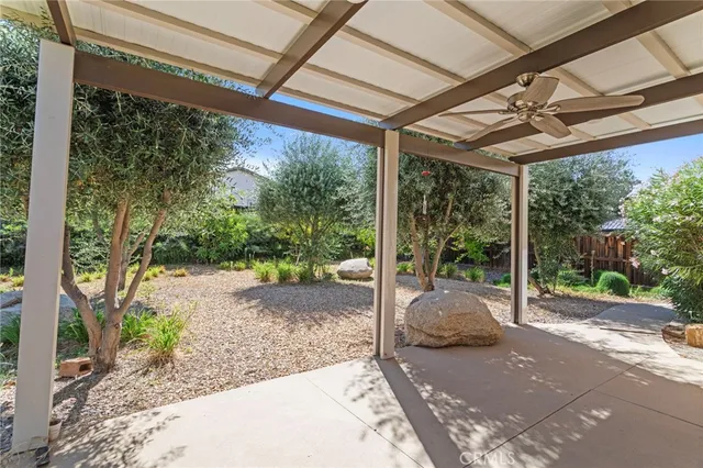 a view of a patio with table and chairs
