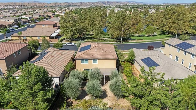 an aerial view of house with yard