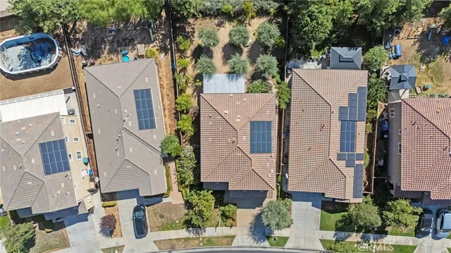 an aerial view of residential houses with outdoor space