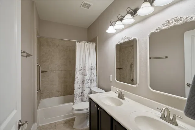 a view of a hallway with wooden floor and windows