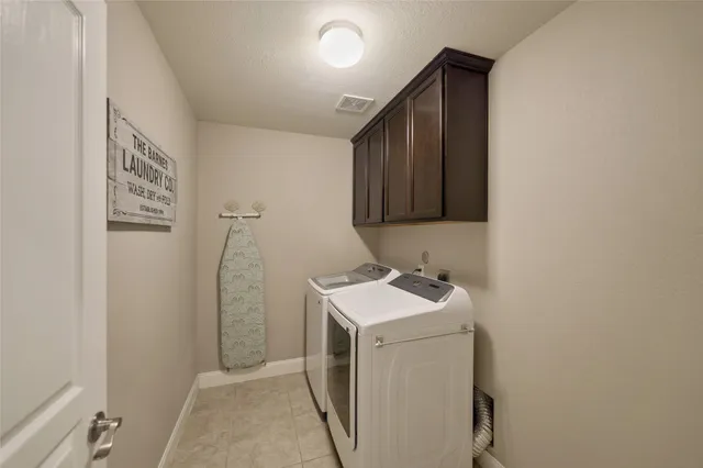 an empty room with closet and windows