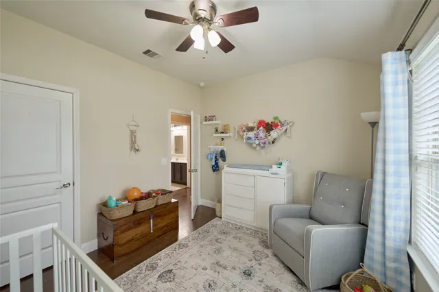 a view of a hallway with paintings on the wall