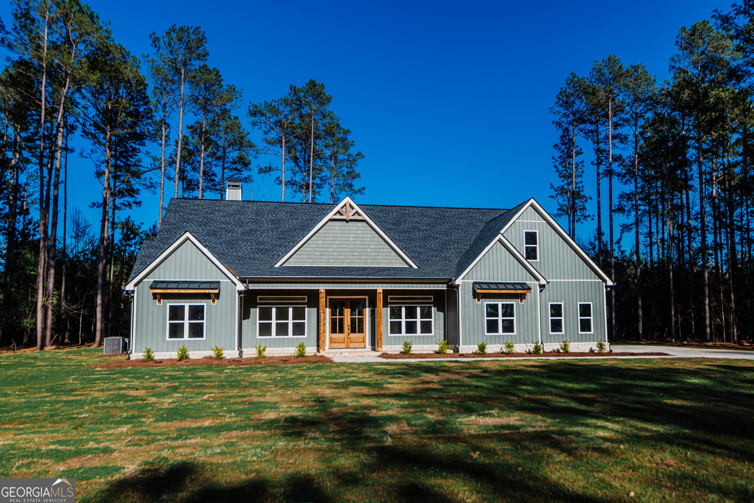 2089 Willow Lake Road Fort Valley, GA 31030 - Photo 1 of 50 a front view of a house with a garden