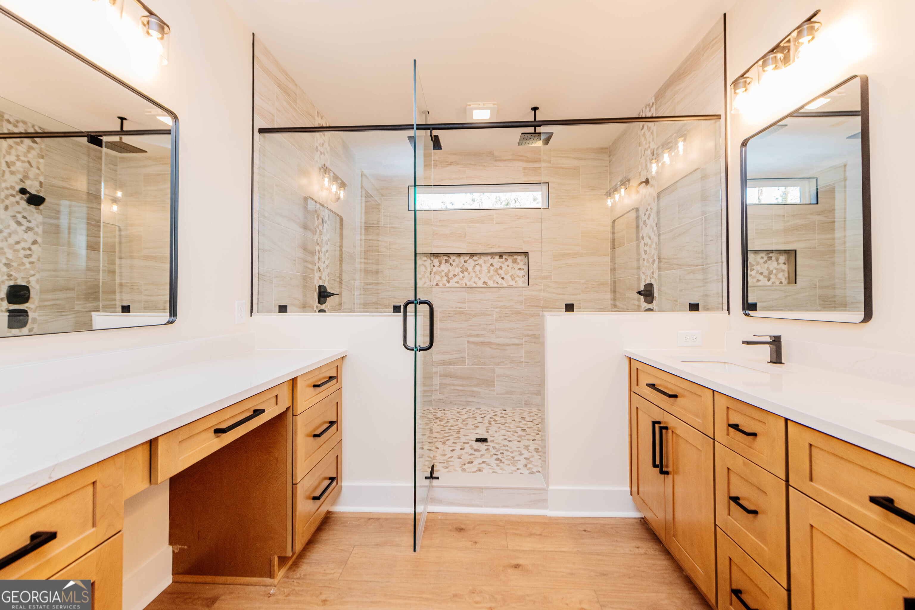 2089 Willow Lake Road Fort Valley, GA 31030 - Photo 16 of 50 a spacious bathroom with double vanity and a mirror