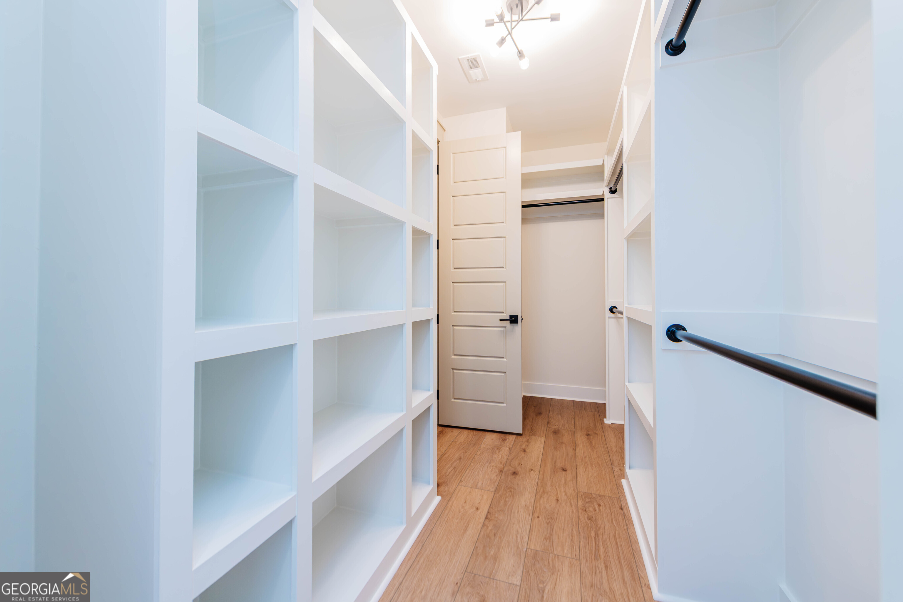 2089 Willow Lake Road Fort Valley, GA 31030 - Photo 22 of 50 a view of walk in closet with wooden floor