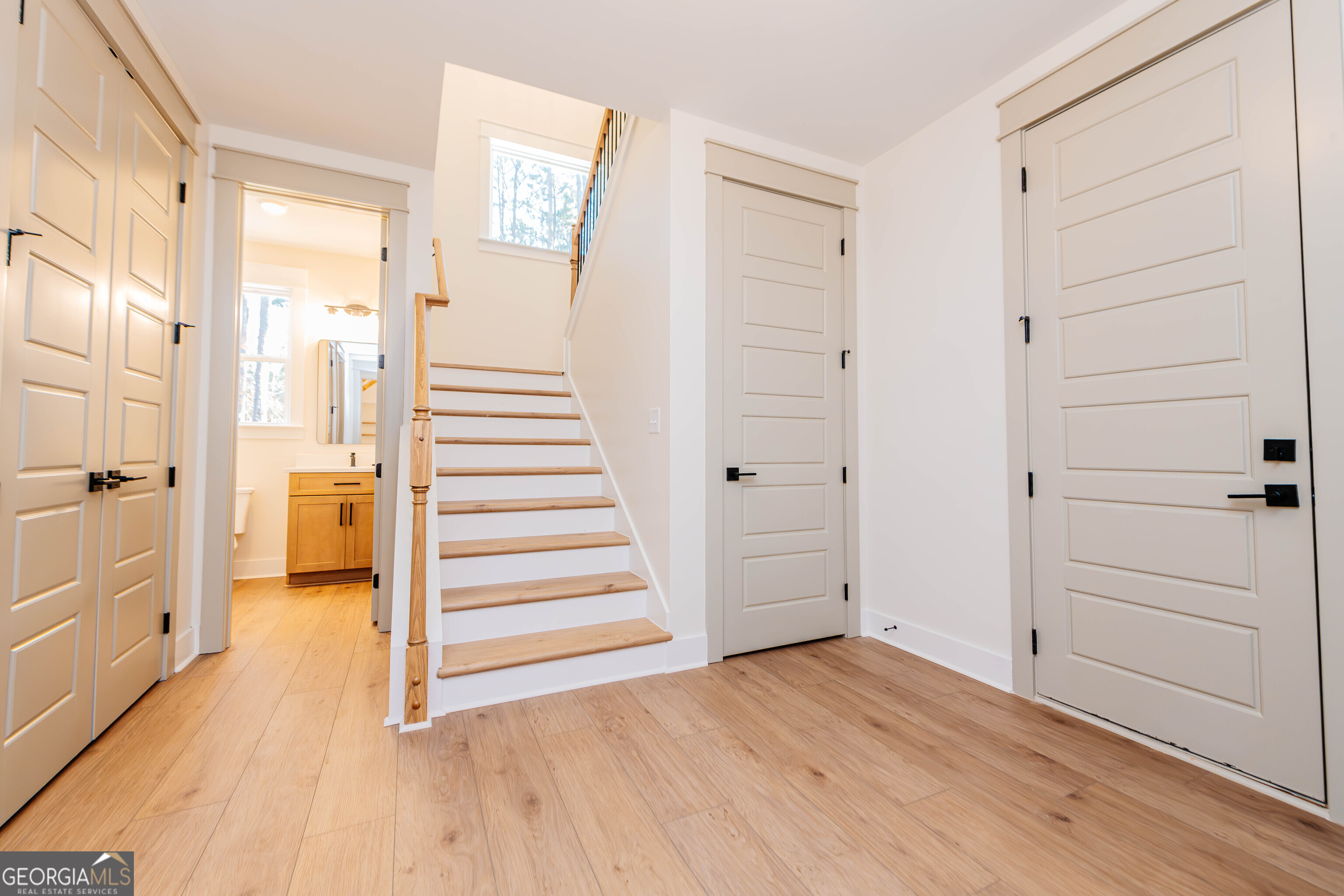 2089 Willow Lake Road Fort Valley, GA 31030 - Photo 28 of 50 a view of a hallway with wooden floor and closet