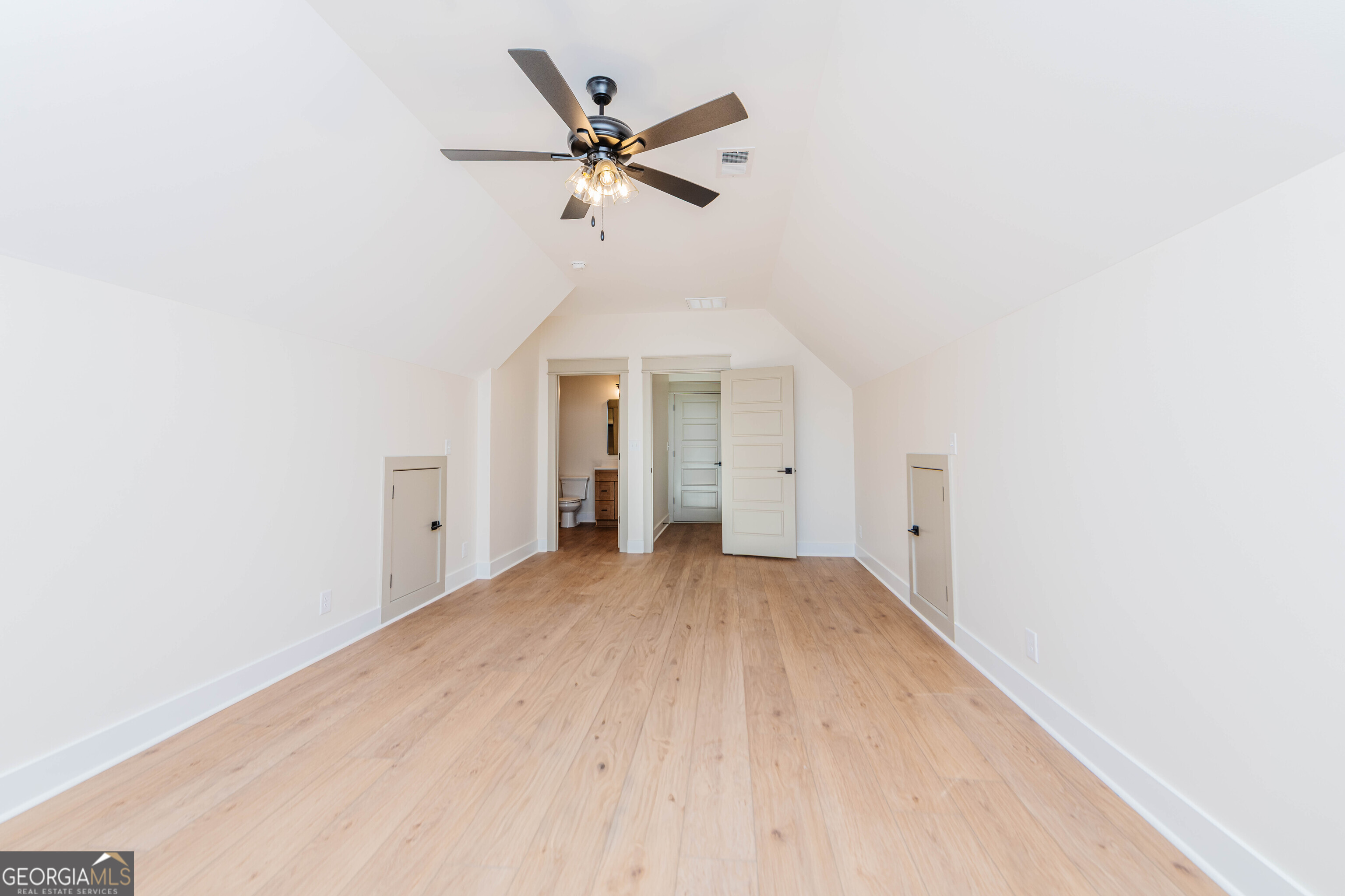2089 Willow Lake Road Fort Valley, GA 31030 - Photo 32 of 50 a view of a livingroom with a ceiling fan and wooden floor