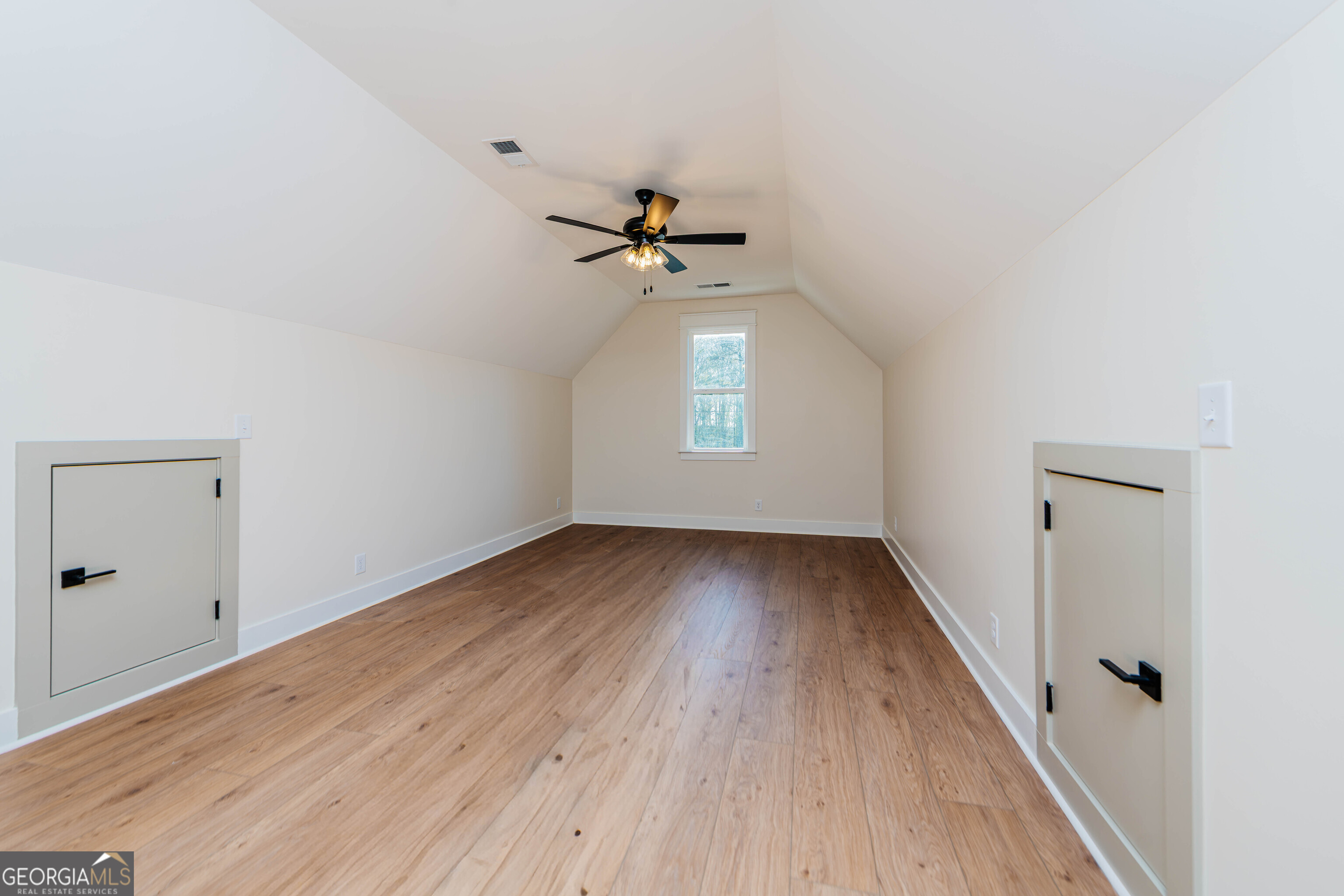 2089 Willow Lake Road Fort Valley, GA 31030 - Photo 33 of 50 wooden floor in an empty room with a window