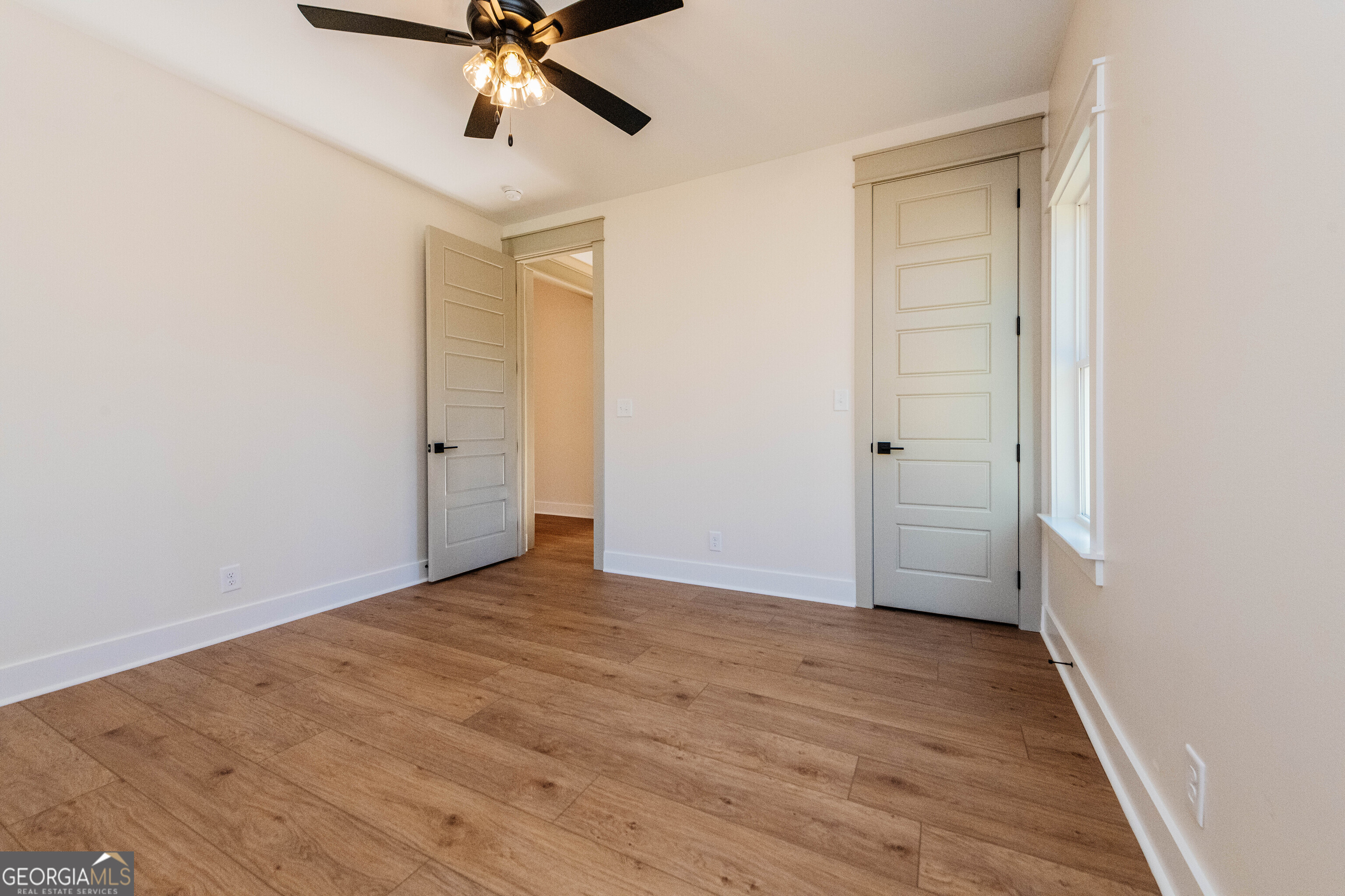 2089 Willow Lake Road Fort Valley, GA 31030 - Photo 43 of 50 wooden floor in an empty room