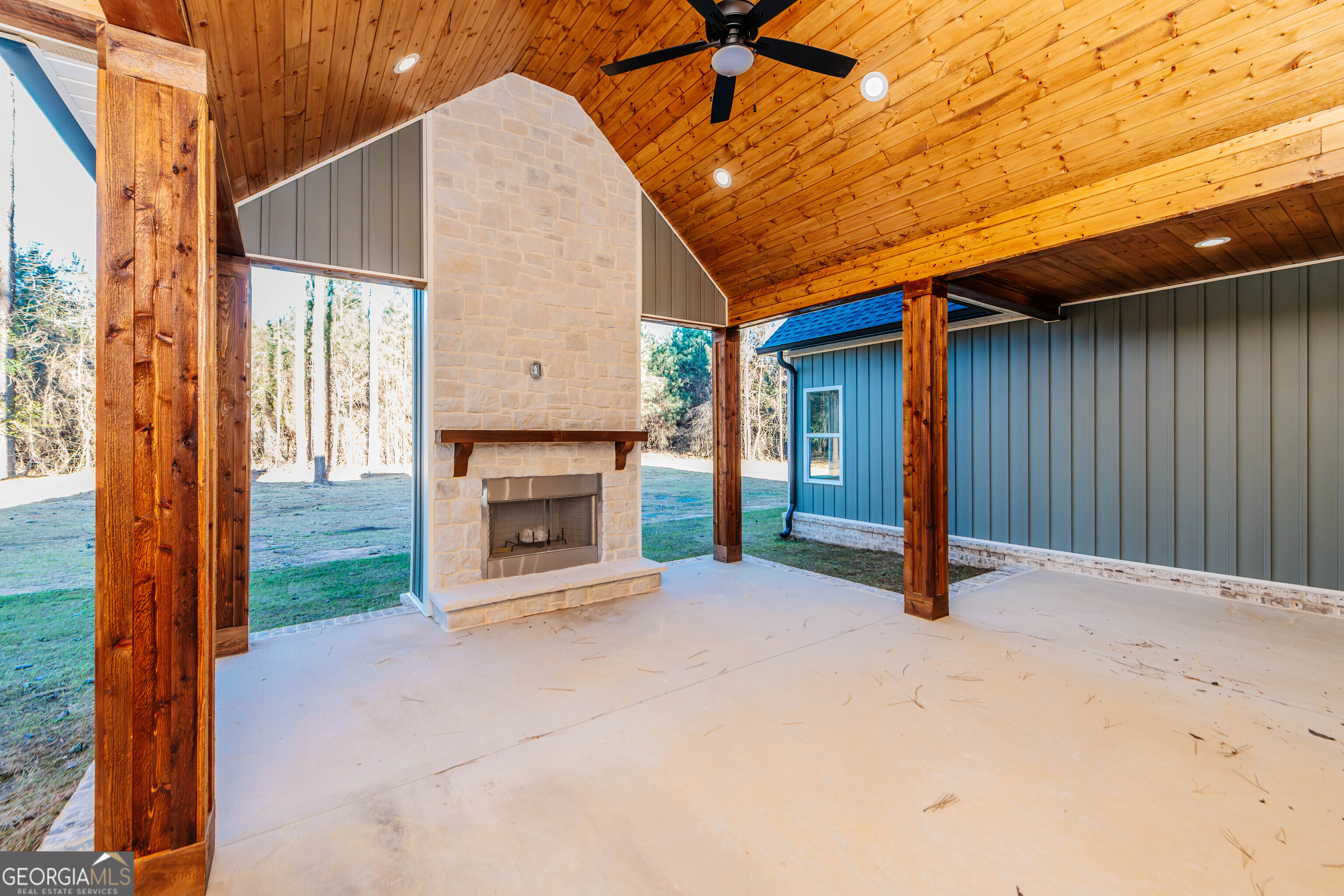 2089 Willow Lake Road Fort Valley, GA 31030 - Photo 44 of 50 a view of an empty room with a fireplace and a window