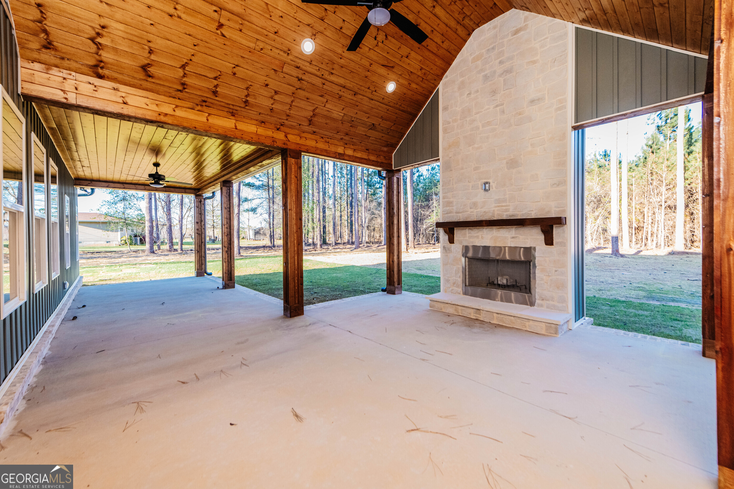 2089 Willow Lake Road Fort Valley, GA 31030 - Photo 45 of 50 a view of an empty room with a fireplace and a window