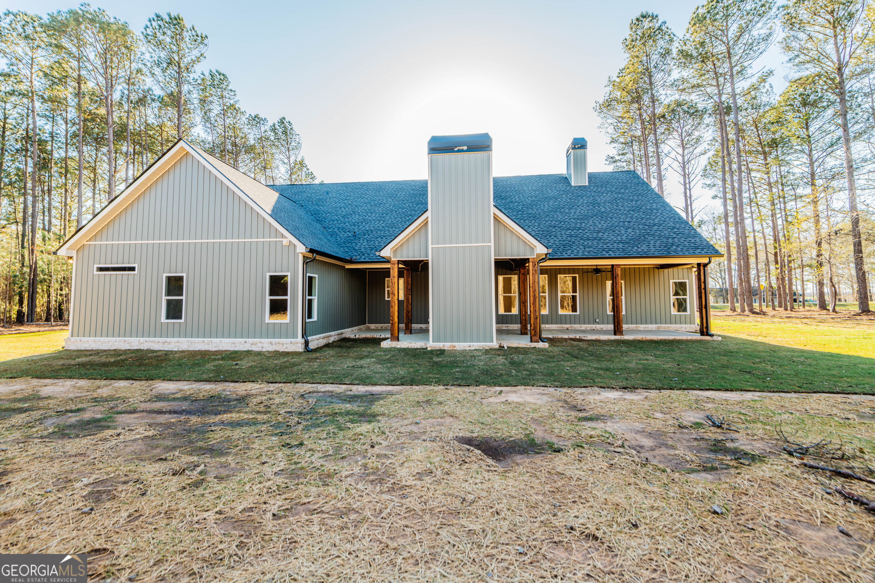 2089 Willow Lake Road Fort Valley, GA 31030 - Photo 47 of 50 a view of a yard in front of a house with large trees