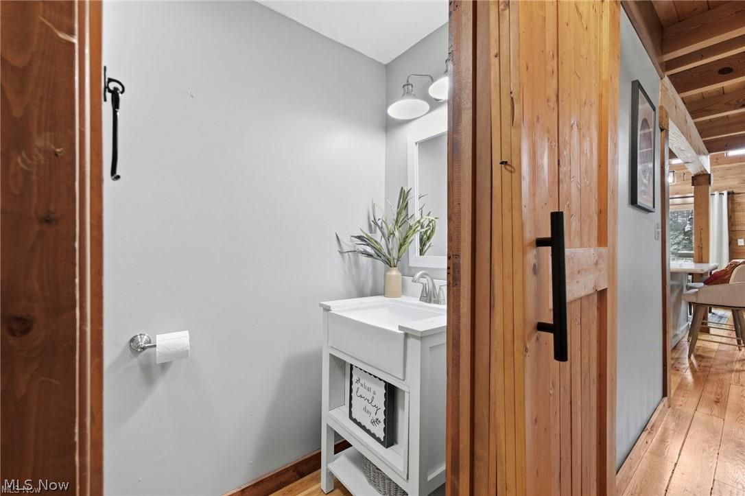 5352 Lance Road Medina, OH 44256 - Photo 21 of 43 Half bath featuring vanity and light wood-style flooring