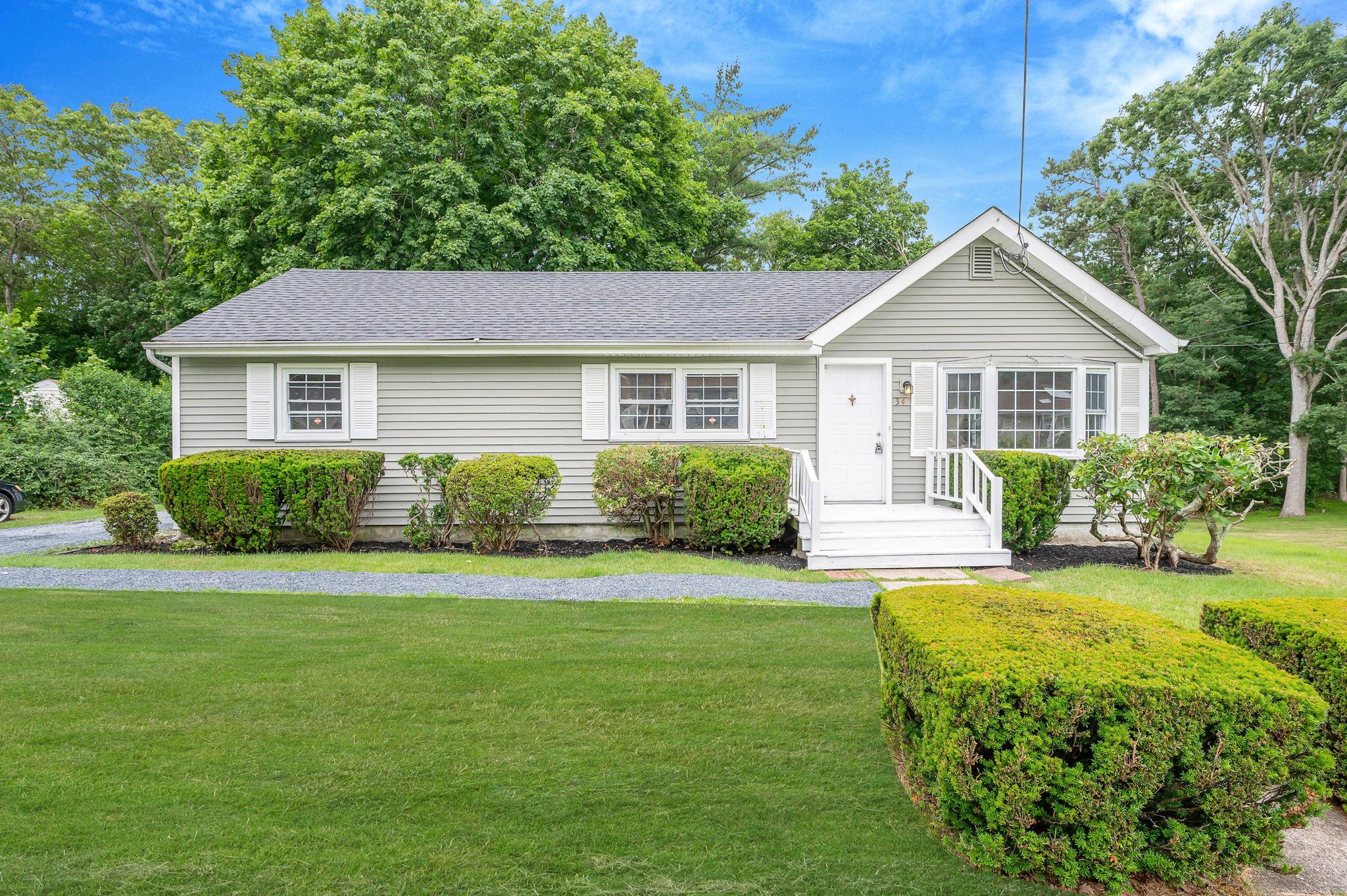 34 Woodville Road Middle Island, NY 11953 - Photo 1 of 1 a view of a house with a yard and potted plants