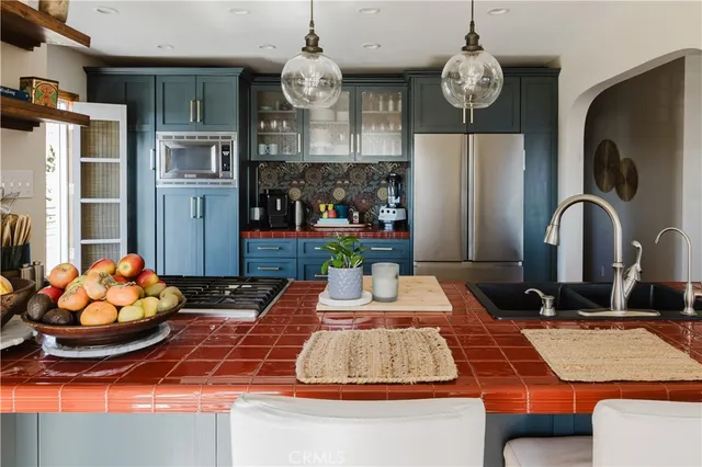 a view of a chairs and table in the patio with a backyard