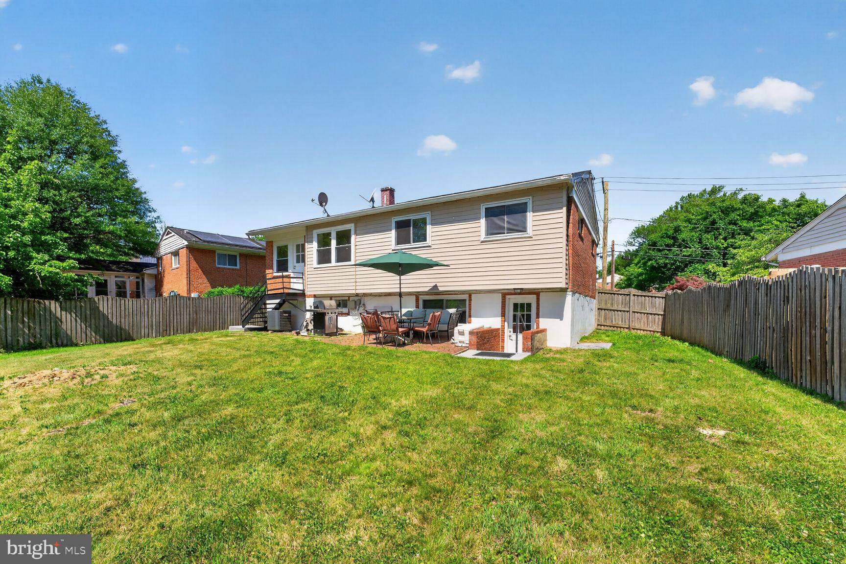1104 Caddington Avenue Silver Spring, MD 20901 - Photo 31 of 35 a view of a house with a yard and sitting area