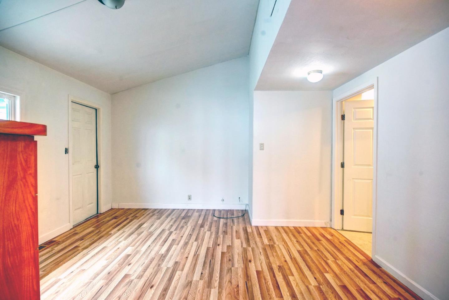 2395 Delaware Avenue, Unit 63 Santa Cruz, CA 95060 - Photo 12 of 16 a view of a room with wooden floor and closet