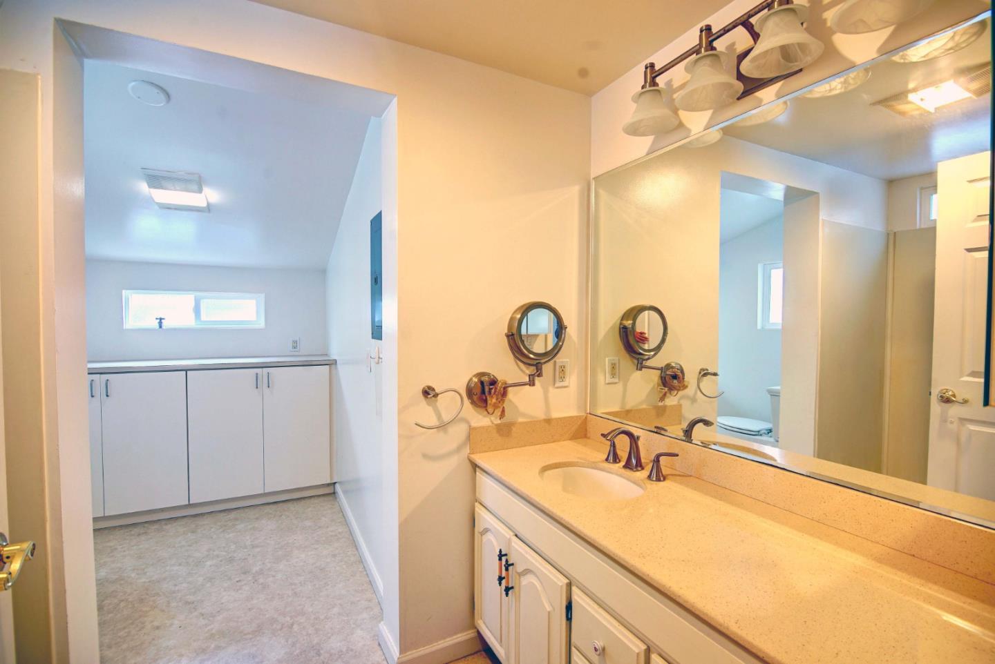 2395 Delaware Avenue, Unit 63 Santa Cruz, CA 95060 - Photo 13 of 16 a spacious bathroom with a sink a mirror a vanity and a shower