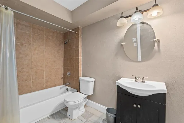 a bathroom with a toilet sink and bathtub