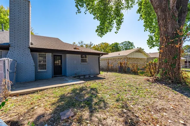 a view of a town with large trees