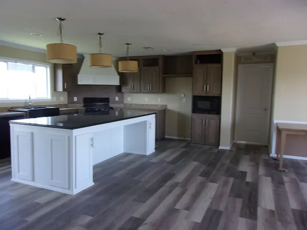 a kitchen with a sink dishwasher a stove and a refrigerator