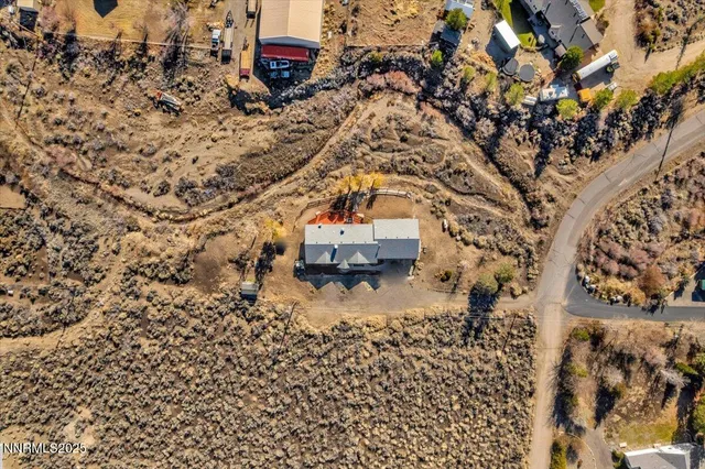 an aerial view of residential building and ocean view