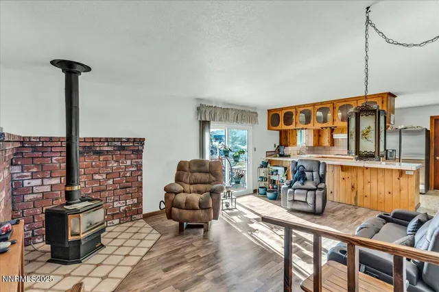 a living room with furniture a rug and a window