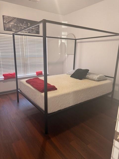 12149 Centerra Drive Hampton, GA 30228 - Photo 12 of 48 a bedroom with a bed and a window