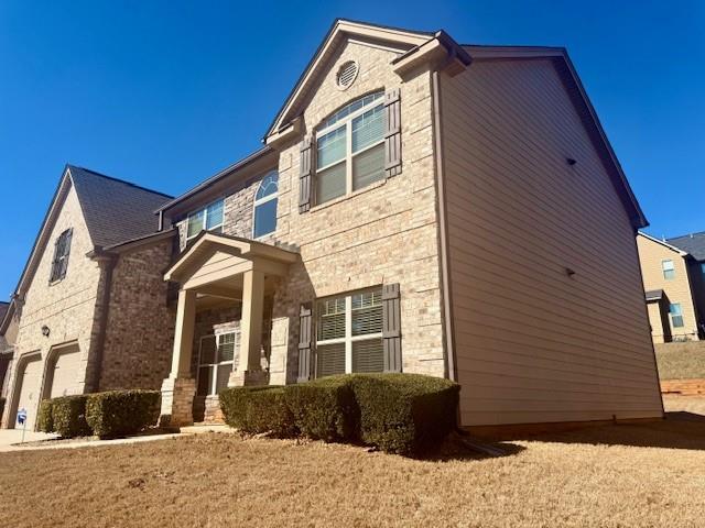 12149 Centerra Drive Hampton, GA 30228 - Photo 2 of 48 a front view of a house