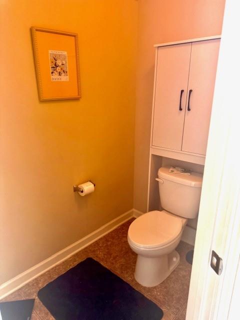 12149 Centerra Drive Hampton, GA 30228 - Photo 27 of 48 a bathroom with a toilet and a shower