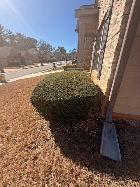 12149 Centerra Drive Hampton, GA 30228 - Photo 3 of 48 a view of a yard in front of a house