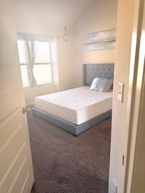 12149 Centerra Drive Hampton, GA 30228 - Photo 31 of 48 a bedroom with a bed and a window