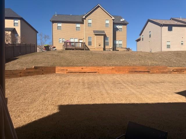 12149 Centerra Drive Hampton, GA 30228 - Photo 47 of 48 a view of a house with backyard space and balcony