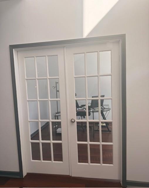 12149 Centerra Drive Hampton, GA 30228 - Photo 7 of 48 a view of an empty room with wooden floor and windows