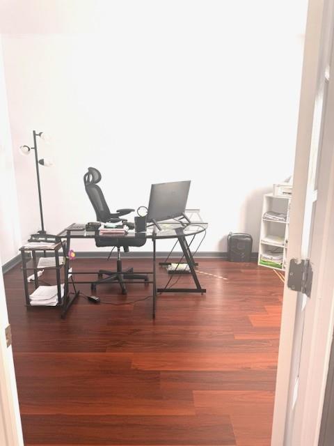 12149 Centerra Drive Hampton, GA 30228 - Photo 10 of 48 a workspace with furniture and wooden floor