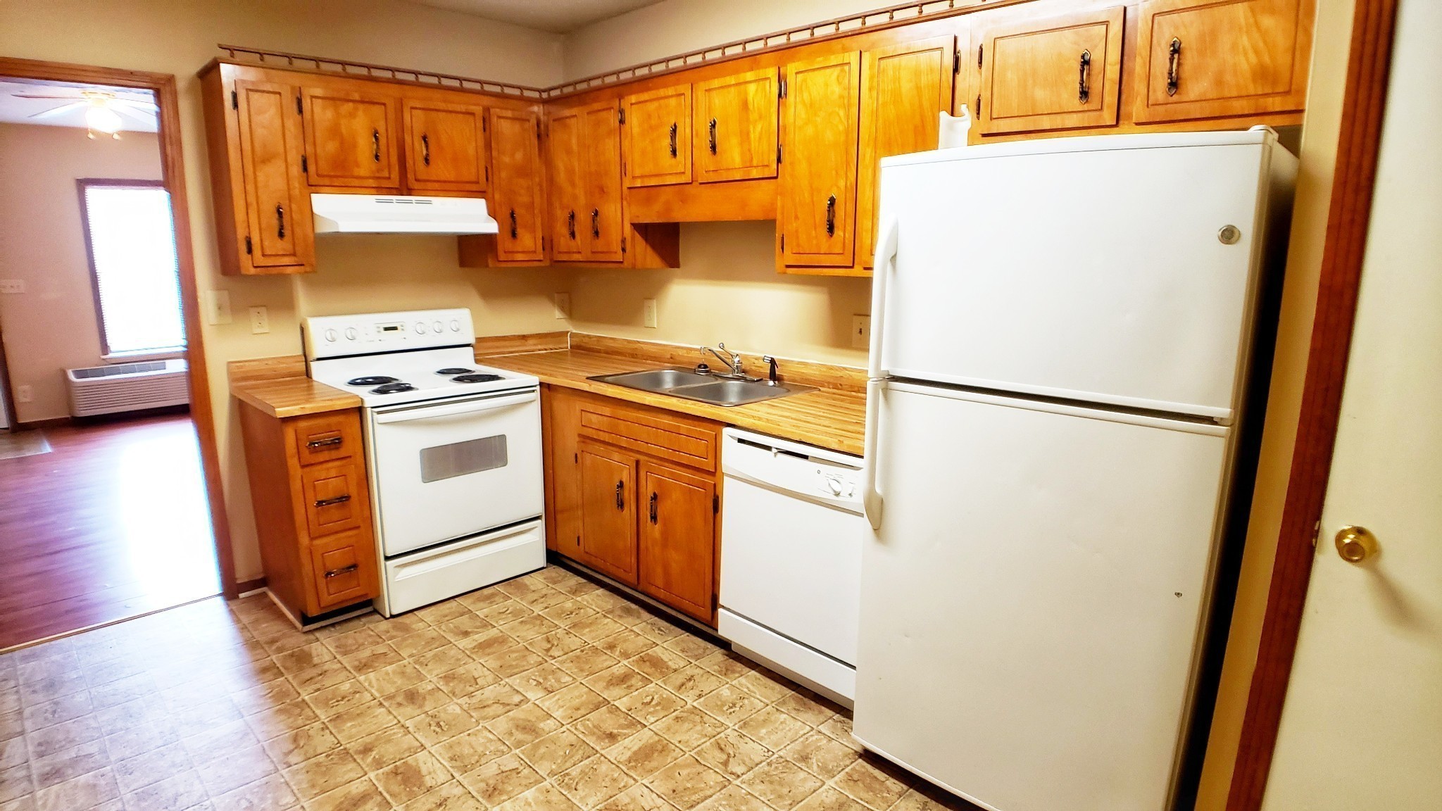 706 Peachers Drive, Unit C Clarksville, TN 37042 - Photo 2 of 15 a kitchen with stainless steel appliances granite countertop a refrigerator a stove a sink and a microwave