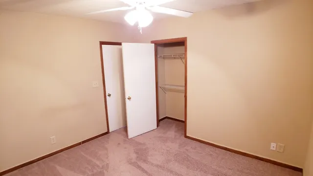 an empty room with a bathroom