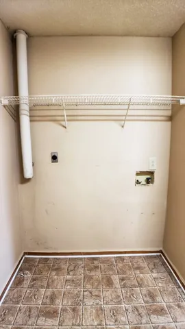 a view of a room with racks on the wall