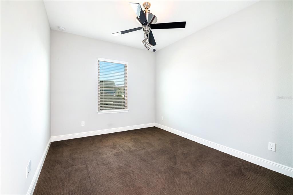 8555 Pinter Street Orlando, FL 32827 - Photo 16 of 32 a view of an empty room with a window