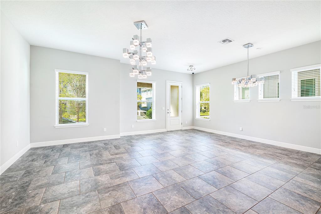 8555 Pinter Street Orlando, FL 32827 - Photo 8 of 32 a view of an empty room with a window