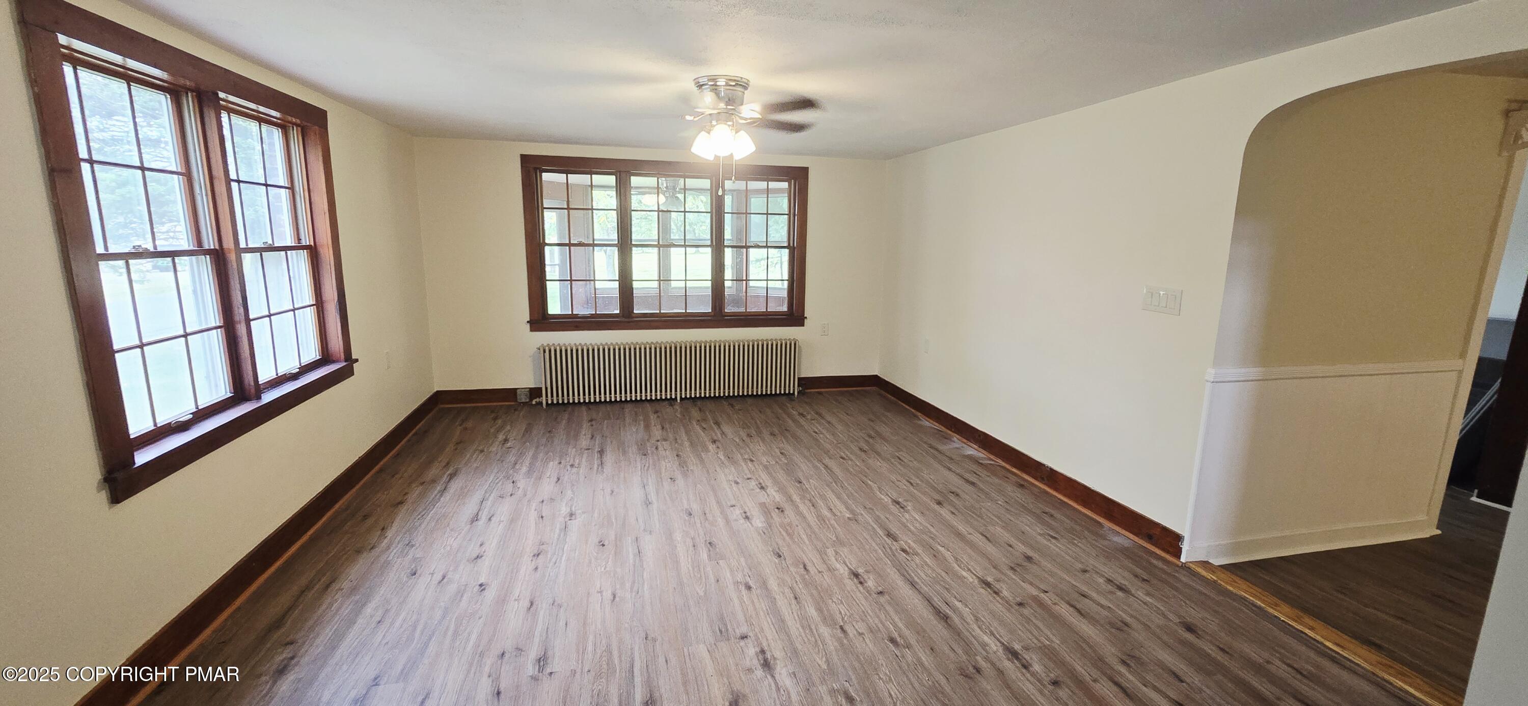 117 Rinker Road Stroudsburg, PA 18360 - Photo 11 of 33 an empty room with wooden floor and windows