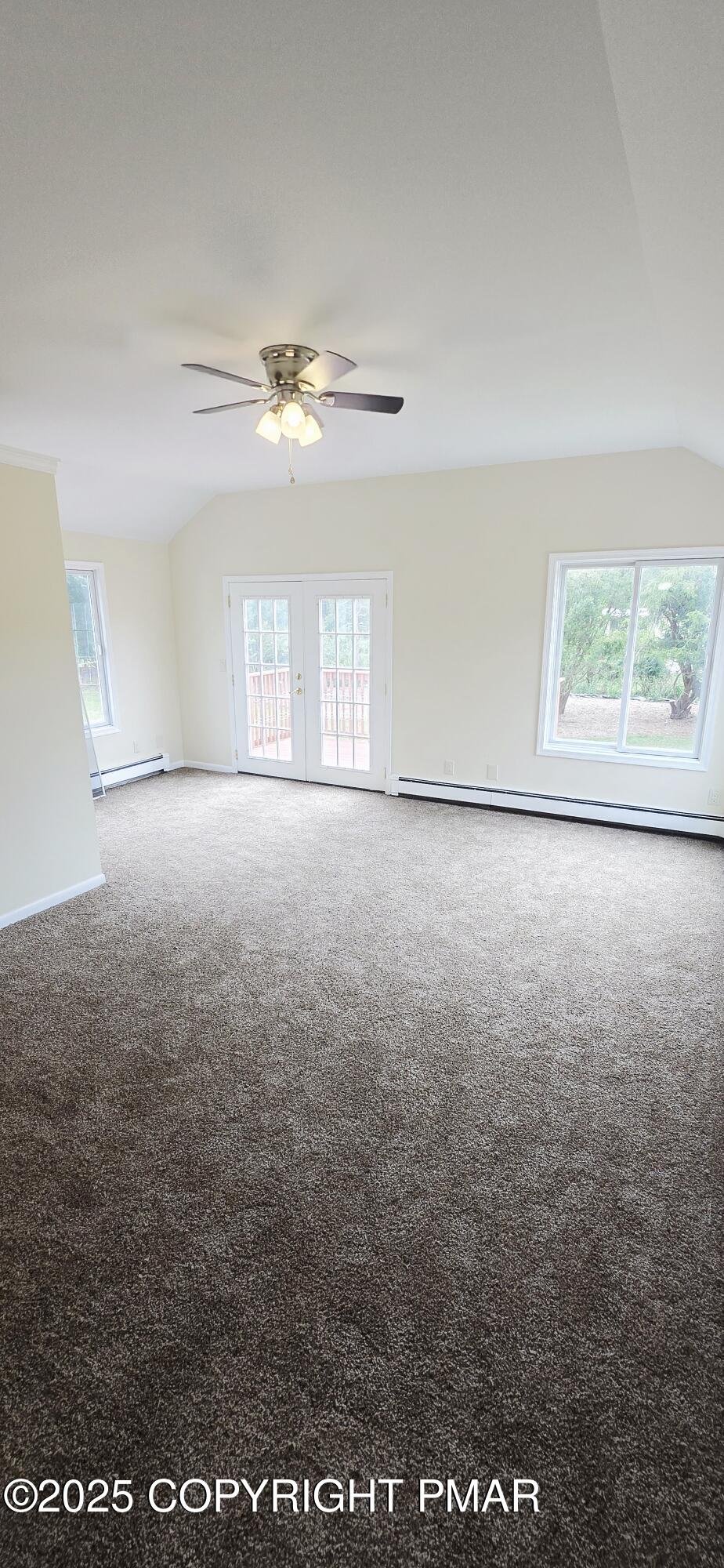 117 Rinker Road Stroudsburg, PA 18360 - Photo 19 of 33 en empty room with windows and ceiling fan