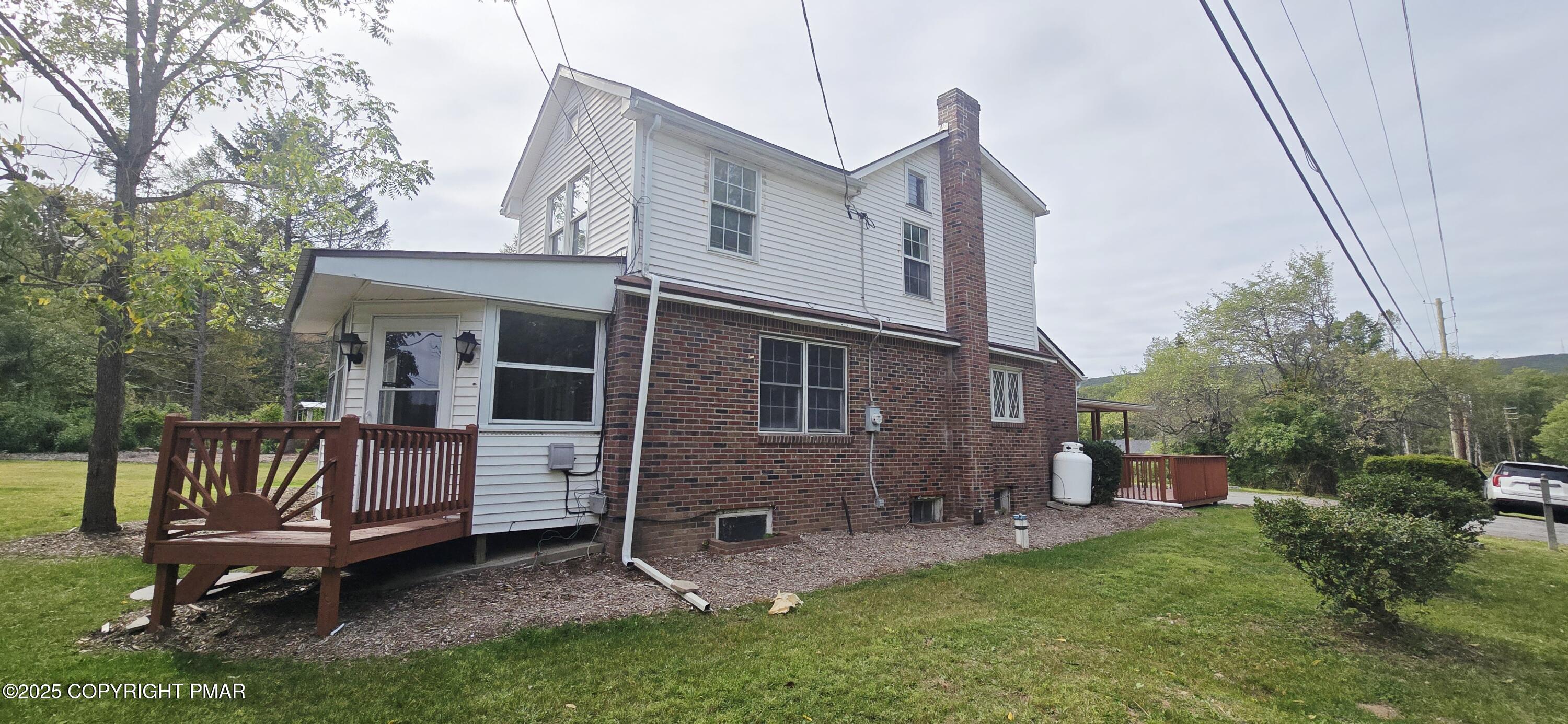 117 Rinker Road Stroudsburg, PA 18360 - Photo 2 of 33 a view of a house with a yard and deck