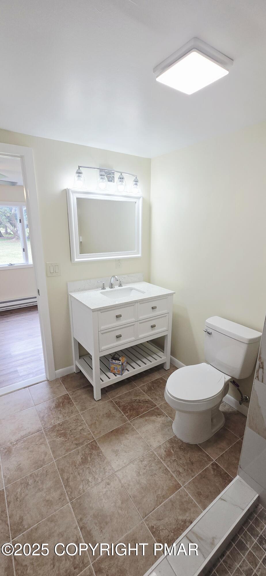 117 Rinker Road Stroudsburg, PA 18360 - Photo 30 of 33 a bathroom with a toilet a sink and a mirror