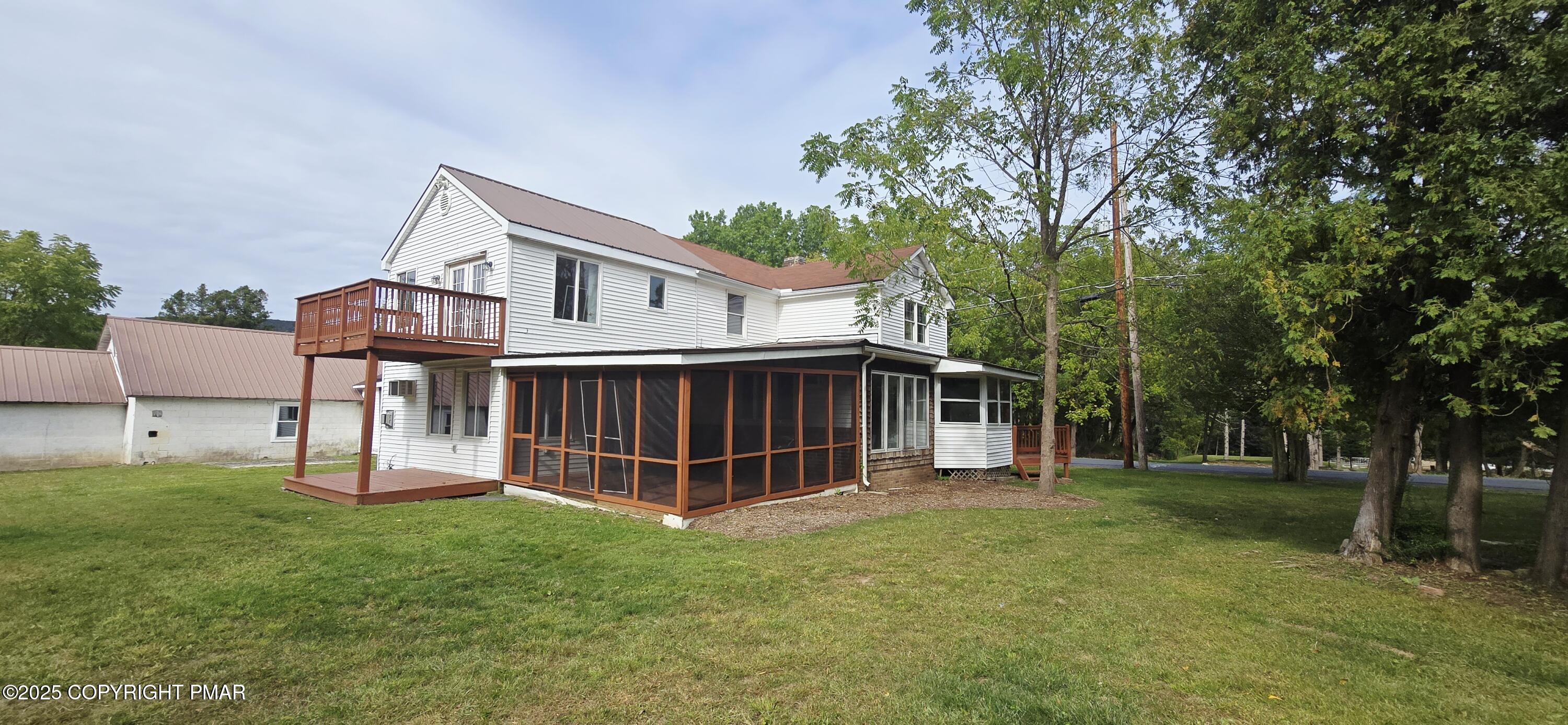 117 Rinker Road Stroudsburg, PA 18360 - Photo 3 of 33 a view of a house with a big yard and large trees