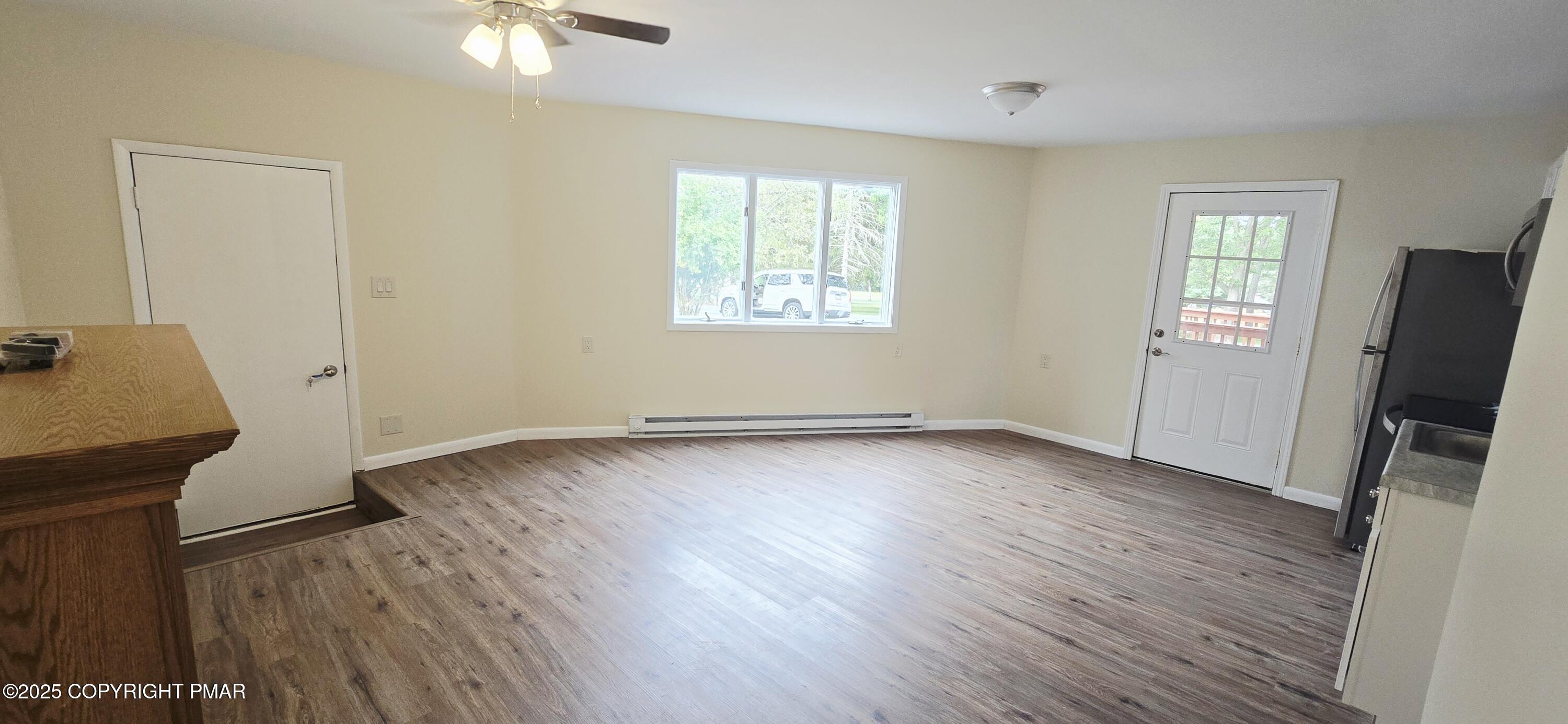 117 Rinker Road Stroudsburg, PA 18360 - Photo 32 of 33 an empty room with wooden floor and windows